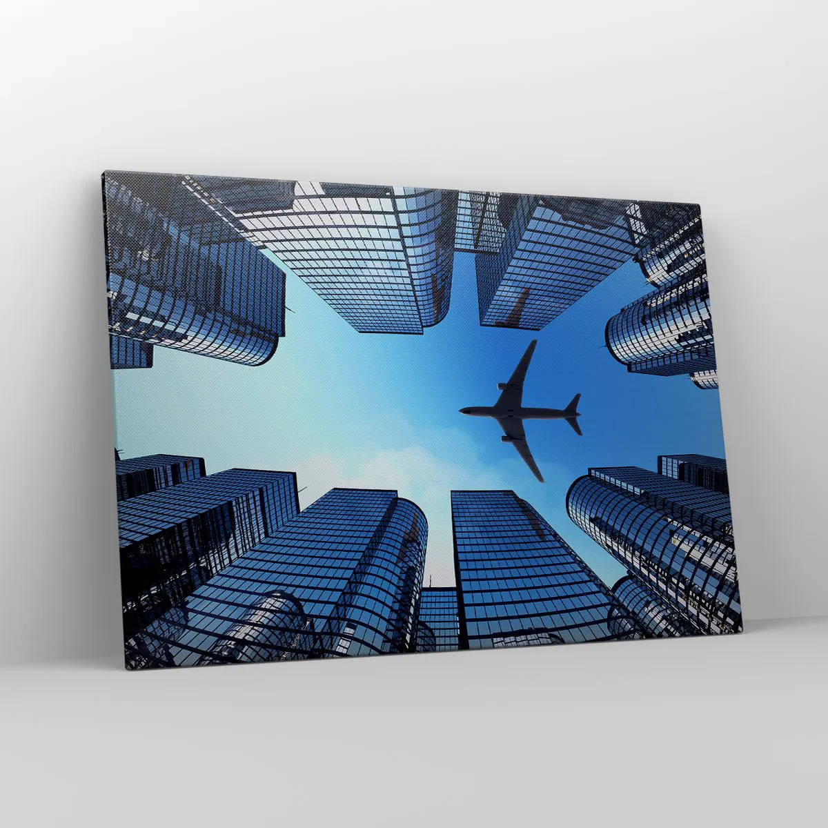 Impression sur toile - Image sur toile - Un avion survolant des gratte-ciels modernes dans le centre-ville. - 100x70cm - La vue depuis le ravin de verre - Décoration murale moderne pour le salon et la chambre ARTTOR