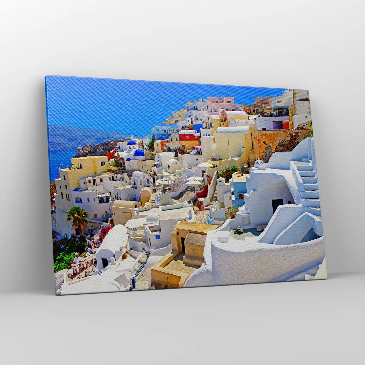 Obraz na płótnie - Panorama Santorini z białymi domami i błękitnym niebem - 100x70cm - Marzenie o greckim lecie - Nowoczesna dekoracja ścienna do salonu, kuchni i sypialni ARTTOR