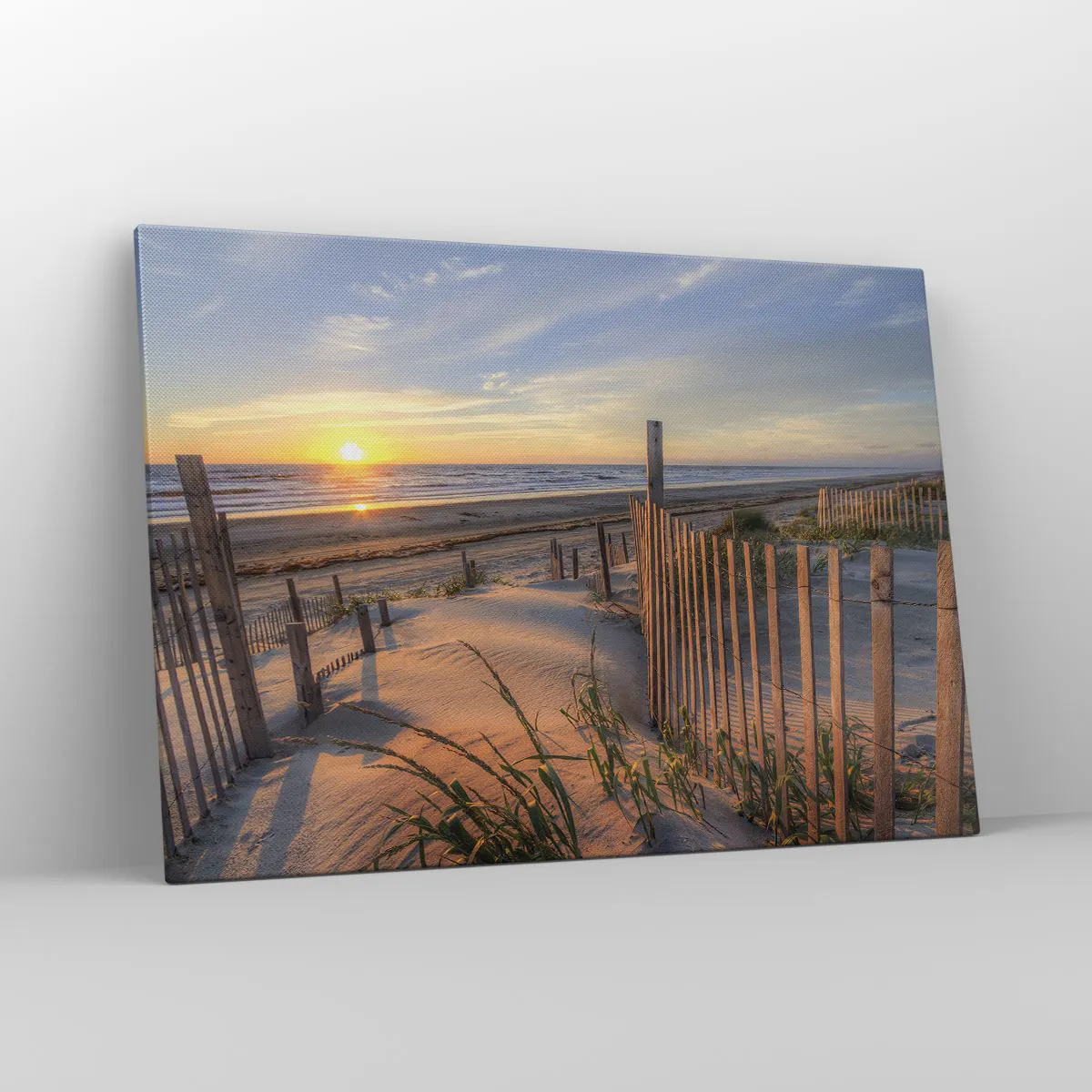 Obraz na płótnie - Plaża o zachodzie słońca z drewnianym ogrodzeniem - 100x70cm - Blask i cień wiatru - Nowoczesna dekoracja ścienna do salonu, kuchni i sypialni ARTTOR