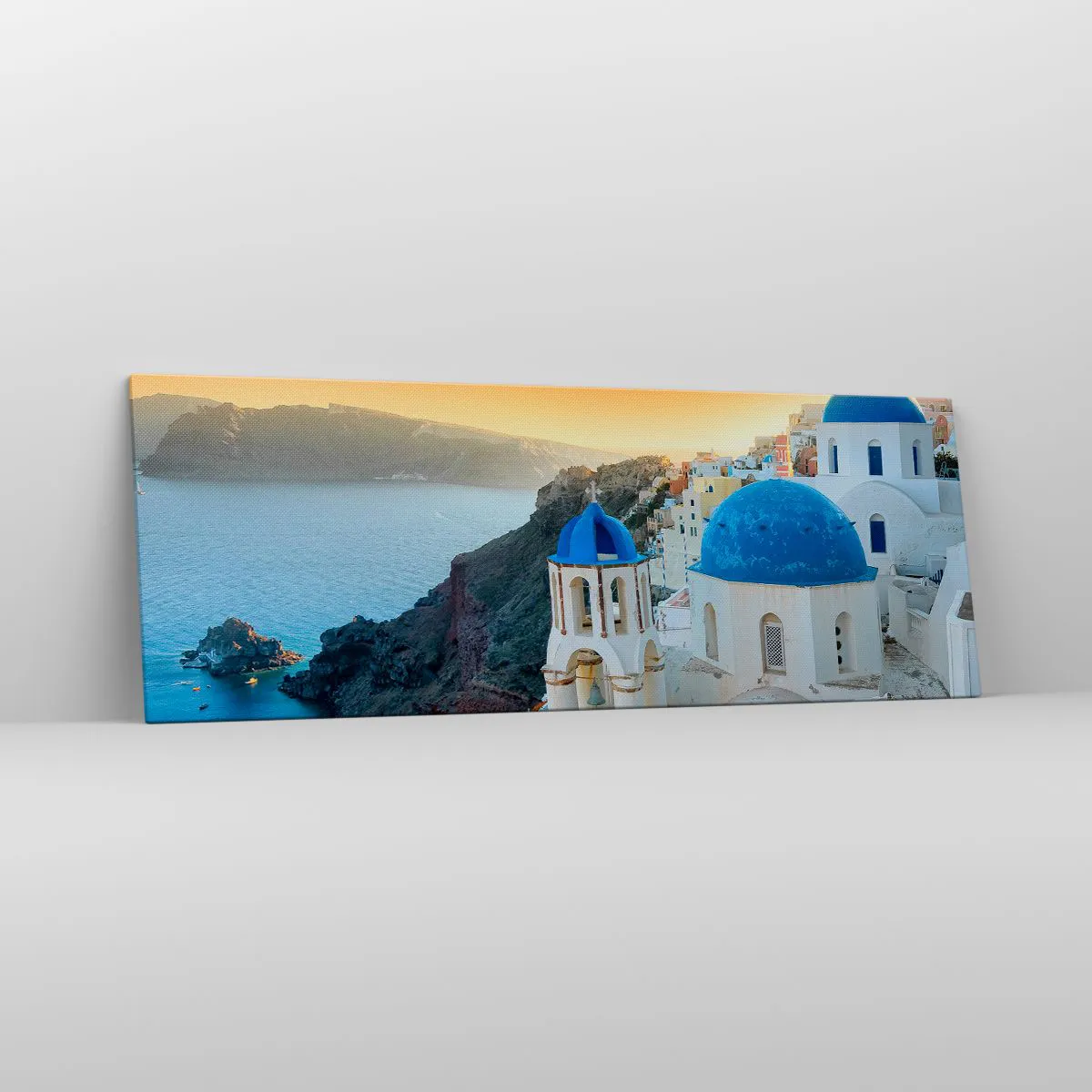 Cuadro sobre lienzo - Impresión de Imagen - Vista de Santorini con edificios blancos y mar azul. - 140x50cm - Santorini - el abrazo a las rocas - Decoración de pared moderna para salón y dormitorio ARTTOR