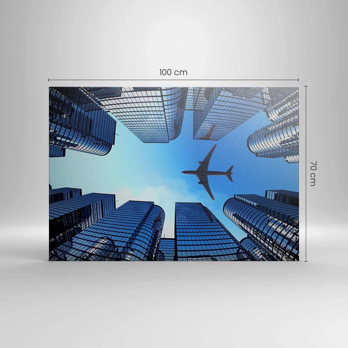 Impression sur toile - Image sur toile - Un avion survolant des gratte-ciels modernes dans le centre-ville. - 100x70cm - La vue depuis le ravin de verre - Décoration murale moderne pour le salon et la chambre ARTTOR