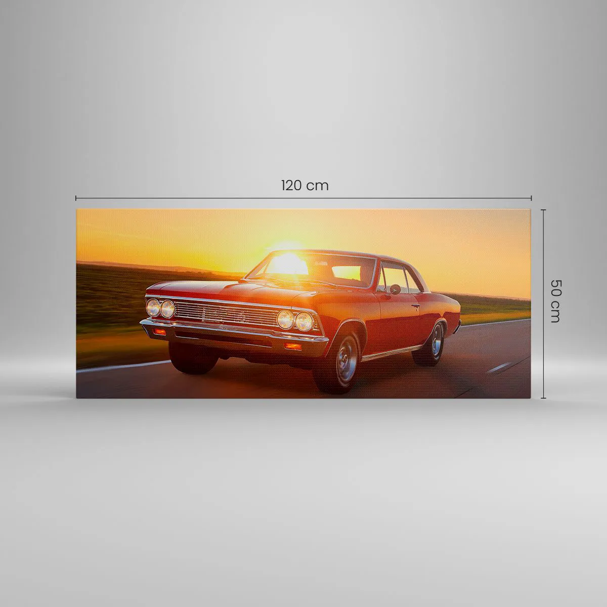 Bild auf Leinwand - Leinwandbild - Ein rotes Auto in der untergehenden Sonne auf einer offenen Straße - 120x50cm - Begehren ist rot - Moderne Wanddekoration für Wohnzimmer und Schlafzimmer ARTTOR