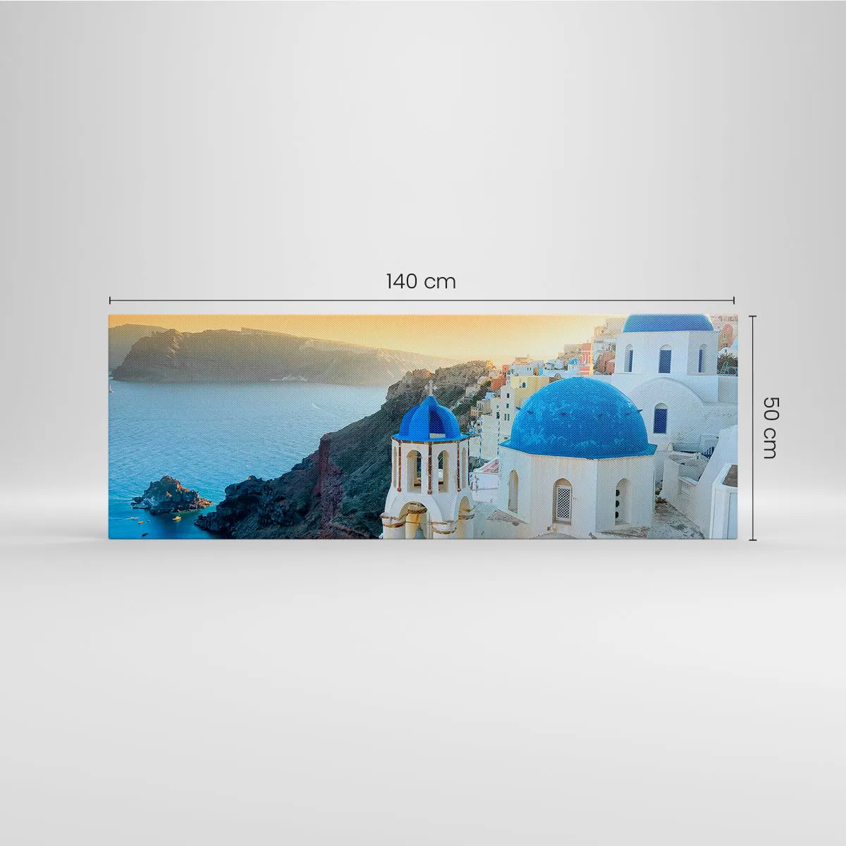 Cuadro sobre lienzo - Impresión de Imagen - Vista de Santorini con edificios blancos y mar azul. - 140x50cm - Santorini - el abrazo a las rocas - Decoración de pared moderna para salón y dormitorio ARTTOR