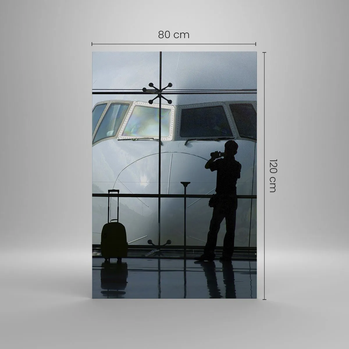Obraz na płótnie - Lotnisko z sylwetkami ludzi i widokiem na samolot - 80x120cm - Vis a vis na lotnisku - Nowoczesna dekoracja ścienna do salonu i sypialni ARTTOR