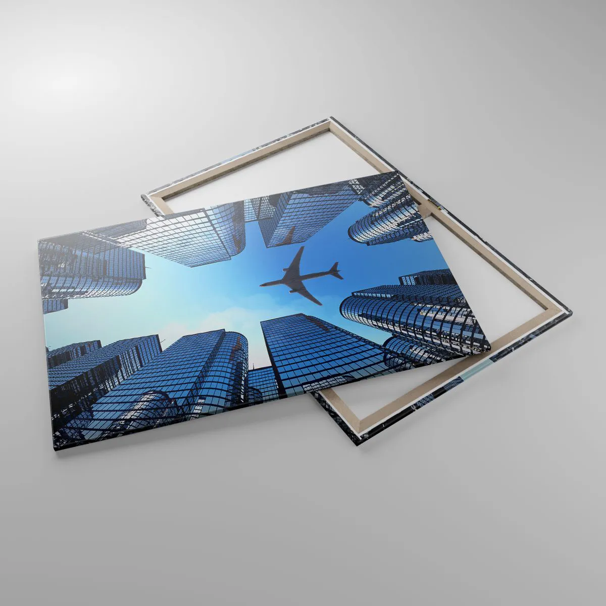 Impression sur toile - Image sur toile - Un avion survolant des gratte-ciels modernes dans le centre-ville. - 100x70cm - La vue depuis le ravin de verre - Décoration murale moderne pour le salon et la chambre ARTTOR