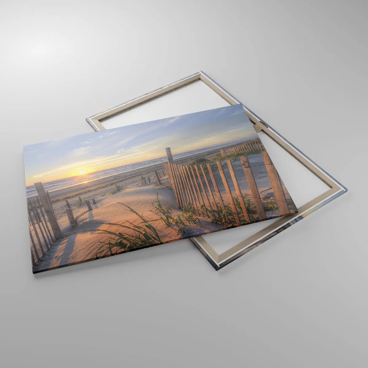 Obraz na płótnie - Plaża o zachodzie słońca z drewnianym ogrodzeniem - 100x70cm - Blask i cień wiatru - Nowoczesna dekoracja ścienna do salonu, kuchni i sypialni ARTTOR