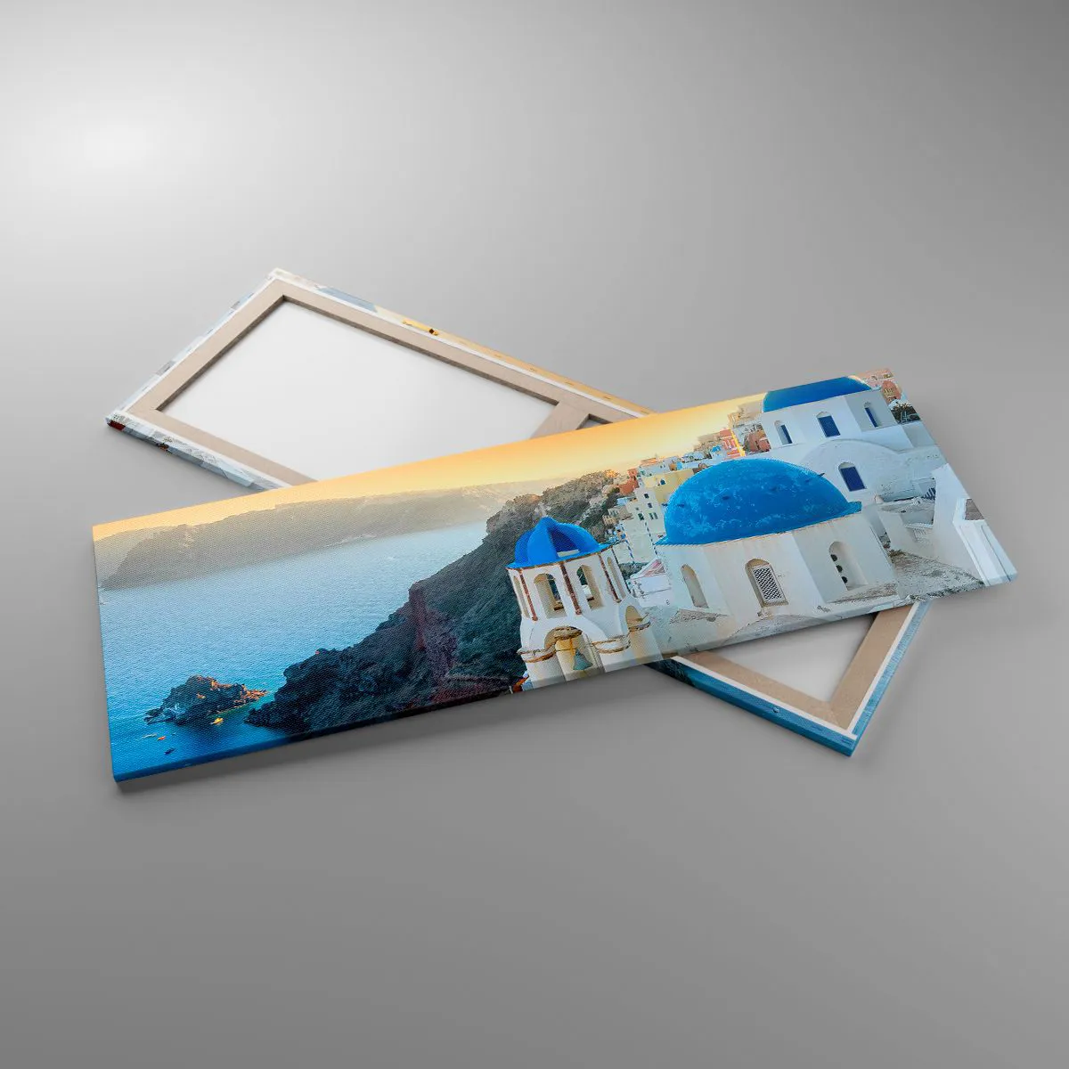 Cuadro sobre lienzo - Impresión de Imagen - Vista de Santorini con edificios blancos y mar azul. - 140x50cm - Santorini - el abrazo a las rocas - Decoración de pared moderna para salón y dormitorio ARTTOR