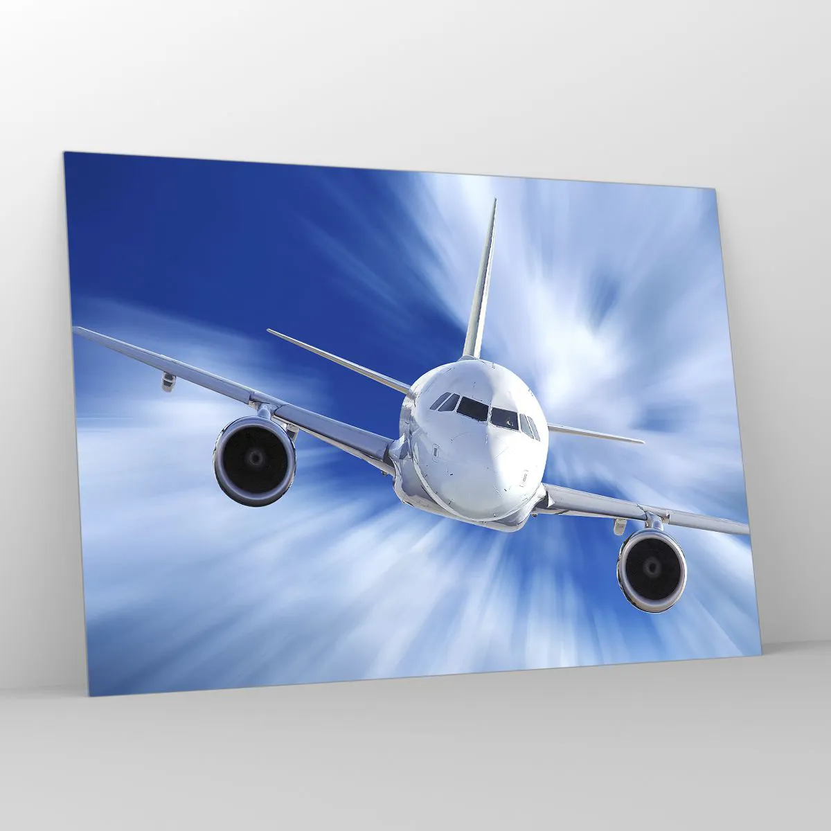 Glasbild - Bild auf glas - Ein Passagierflugzeug vor einem dynamischen blauen Himmel - 100x70cm - Schneller als der Wind am Himmel - Moderne Wanddekoration für Wohnzimmer und Schlafzimmer ARTTOR