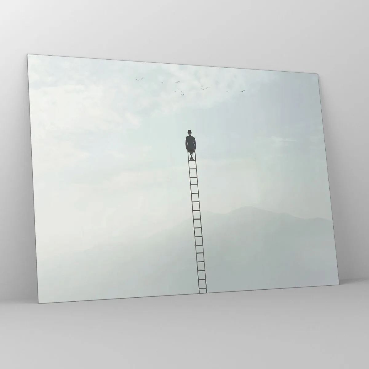Glasbild - Bild auf glas - Silhouette eines Mannes oben auf einer Leiter in den Wolken - 70x50cm - Erhebe dich darüber! - Moderne Wanddekoration für Wohnzimmer und Schlafzimmer ARTTOR
