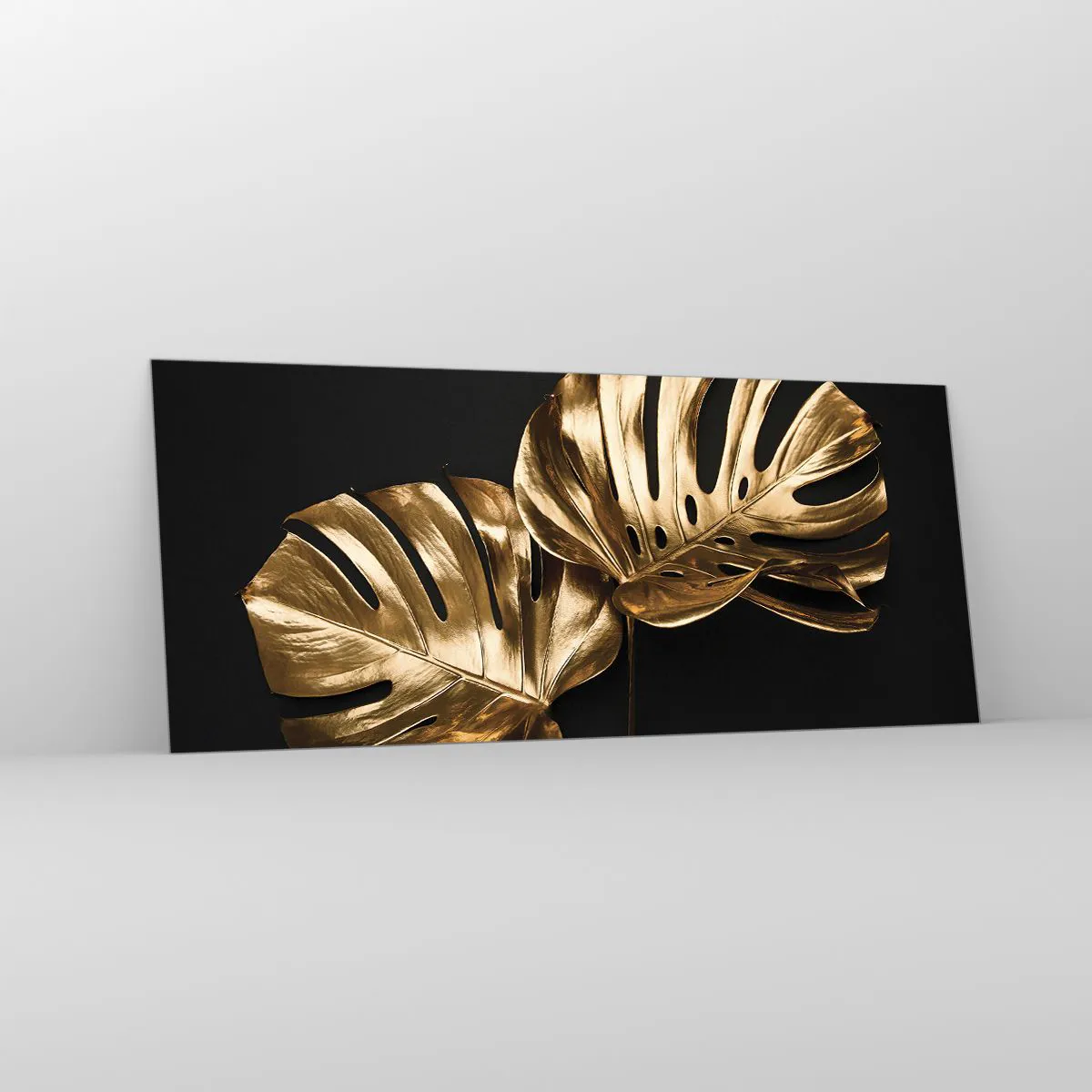 Glasbild - Bild auf glas - Goldene Monstera-Blätter auf schwarzem Hintergrund - 120x50cm - Die Schätze der Natur - Moderne Wanddekoration für Wohnzimmer und Schlafzimmer ARTTOR