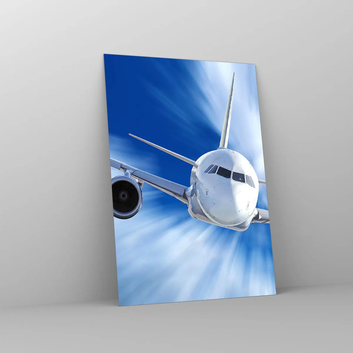 Glasbild - Bild auf glas - Ein Passagierflugzeug in Bewegung gegen den Himmel - 70x100cm - Schneller als der Wind am Himmel - Moderne Wanddekoration für Wohnzimmer und Schlafzimmer ARTTOR