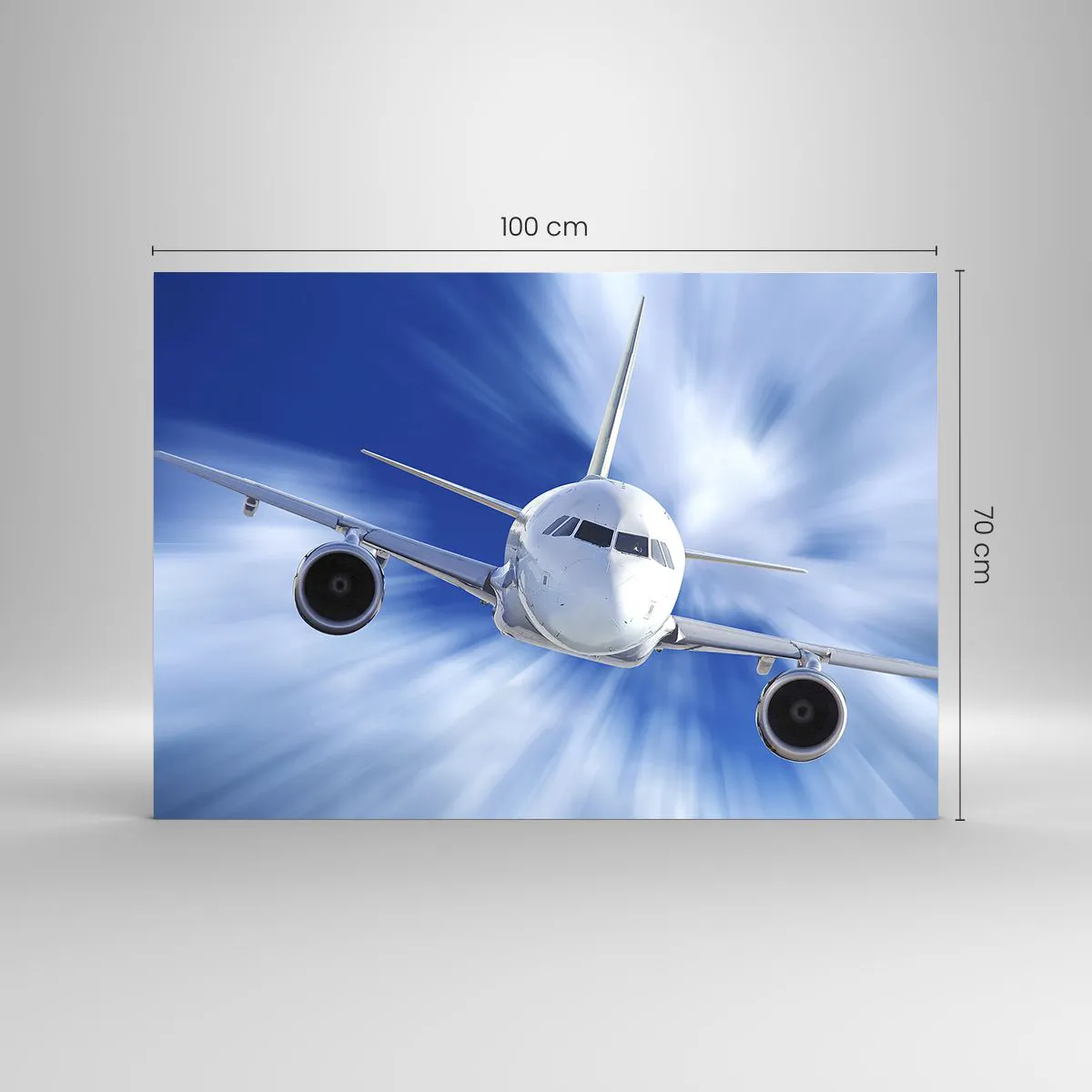 Glasbild - Bild auf glas - Ein Passagierflugzeug vor einem dynamischen blauen Himmel - 100x70cm - Schneller als der Wind am Himmel - Moderne Wanddekoration für Wohnzimmer und Schlafzimmer ARTTOR