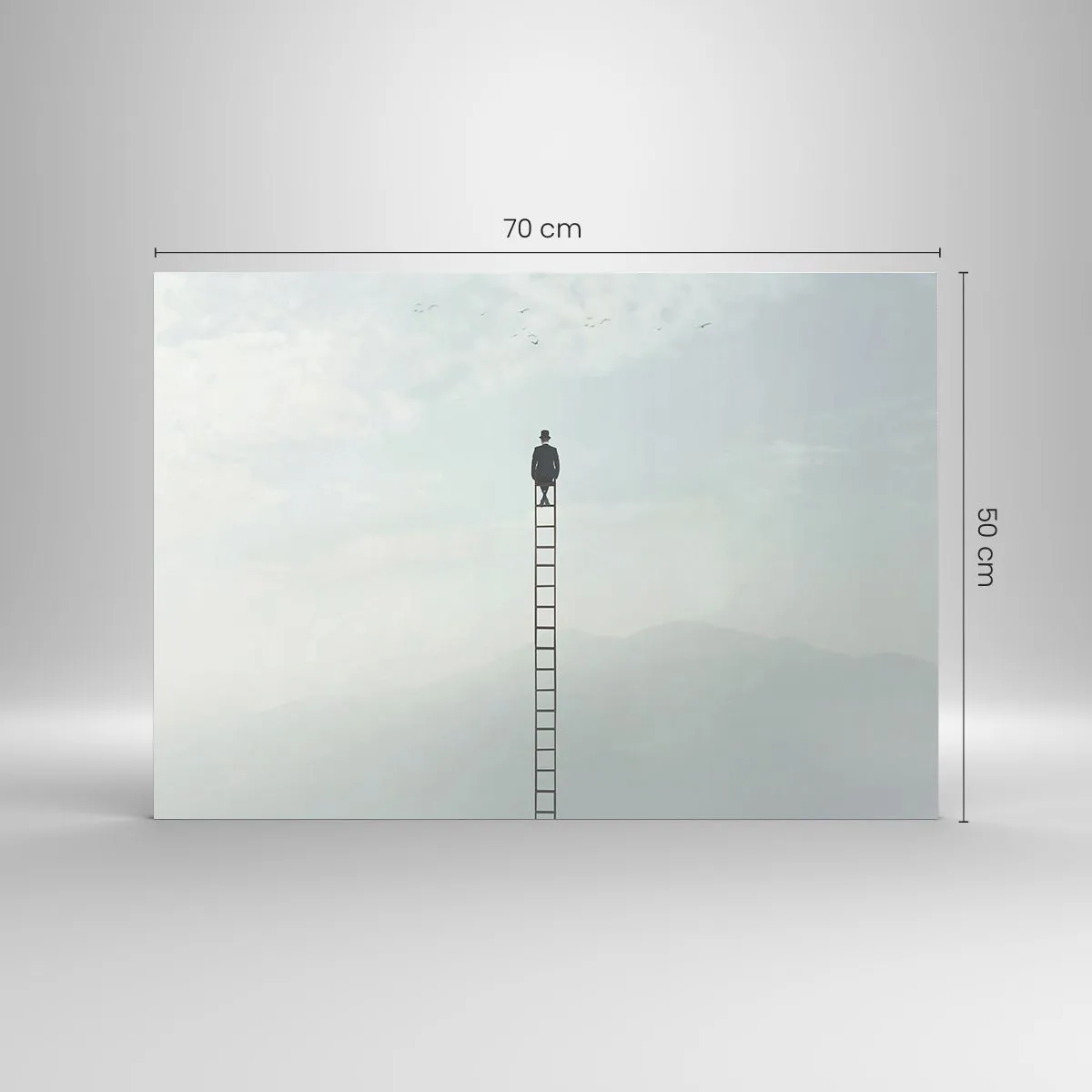 Glasbild - Bild auf glas - Silhouette eines Mannes oben auf einer Leiter in den Wolken - 70x50cm - Erhebe dich darüber! - Moderne Wanddekoration für Wohnzimmer und Schlafzimmer ARTTOR