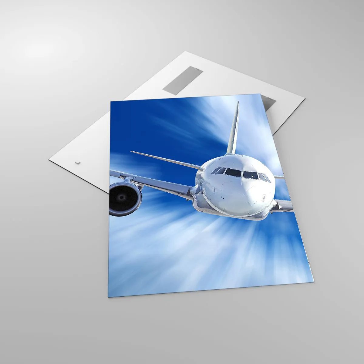 Glasbild - Bild auf glas - Ein Passagierflugzeug in Bewegung gegen den Himmel - 70x100cm - Schneller als der Wind am Himmel - Moderne Wanddekoration für Wohnzimmer und Schlafzimmer ARTTOR