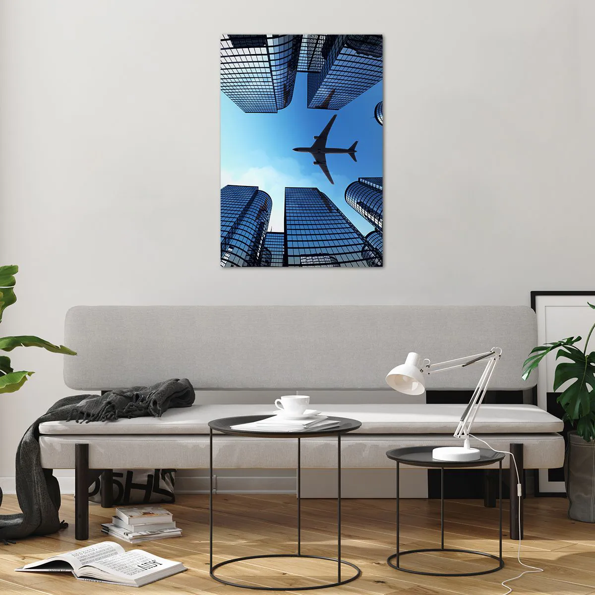 Glasbild - Bild auf glas - Ein Flugzeug fliegt über moderne Wolkenkratzer im Stadtzentrum. - 70x100cm - Der Blick aus der Glasschlucht - Moderne Wanddekoration für Wohnzimmer und Schlafzimmer ARTTOR