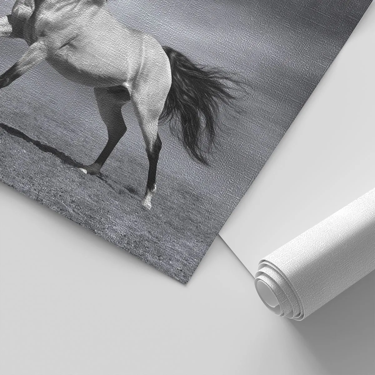 Fototapete Premium Canvas - Ein schwarz-weißes Pferd in einer dynamischen Pose in der Wüste. - 100x70cm - Geboren um Freude zu bereiten - Moderne Wanddekoration für Wohnzimmer und Schlafzimmer ARTTOR